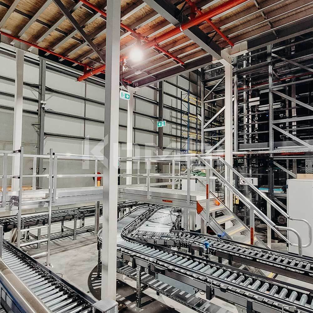 KOMBI Aluminium Access Stairs and Elevated Platforms over intralogistics conveyor belt system