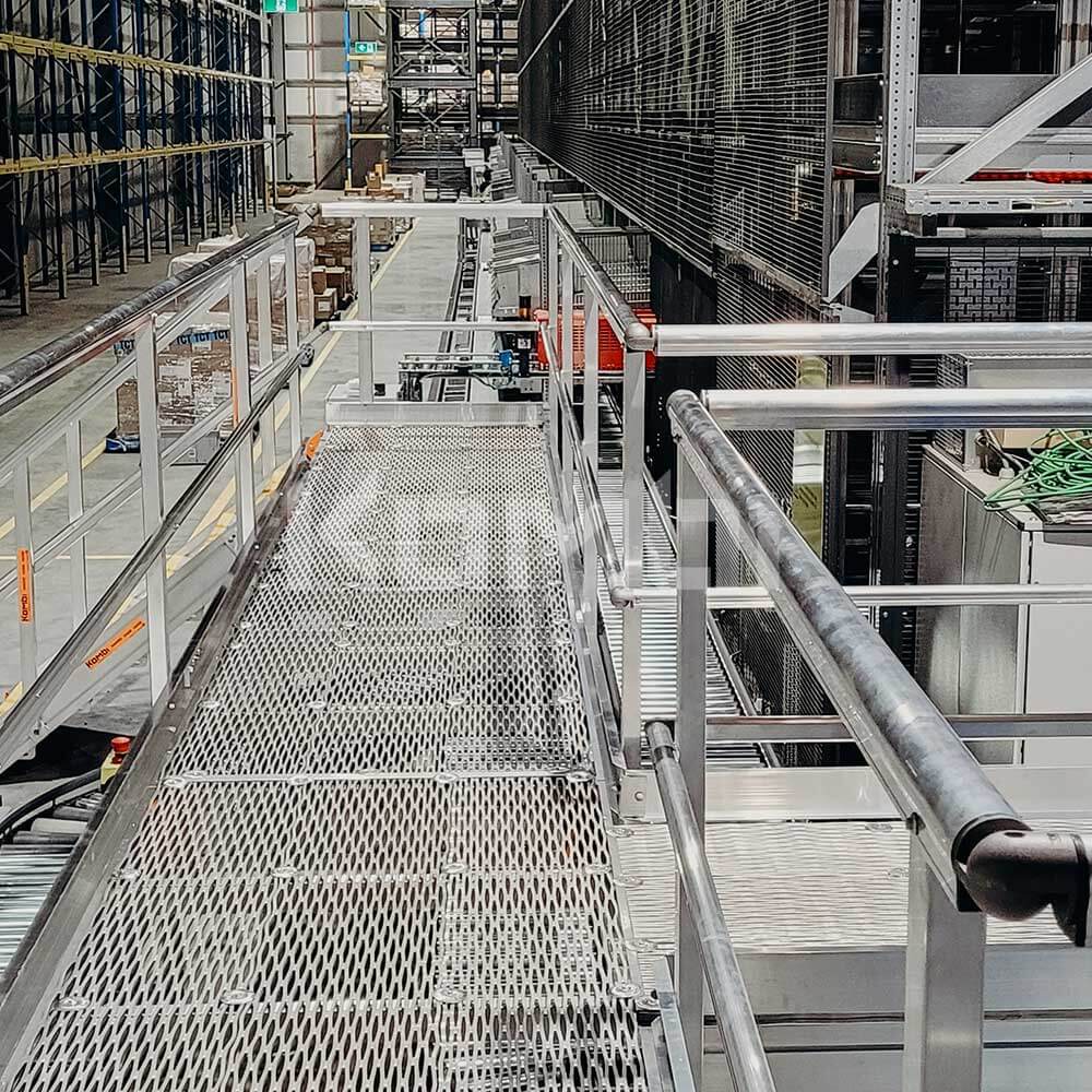 Intralogistic solutions using KOMBI Elevated Platforms access by stairs